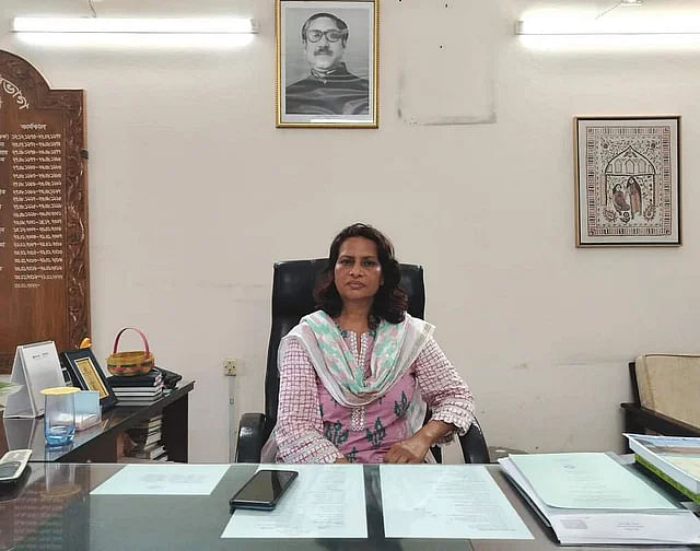 Professor Shamima Sultana removes the portrait of Prime Minister Sheikh Hasina from her office at Jahangirnagar University on 1 August, 2024.